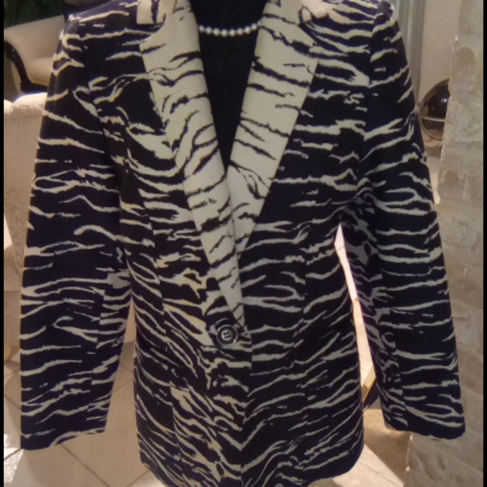 Black and white blazer size o but fits larger